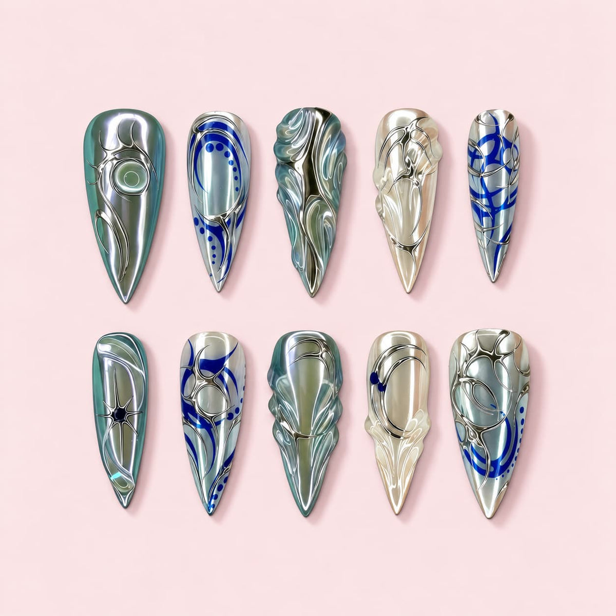 Abalone Noir stiletto press-on nails in black and fuchsia with iridescent shell panels framed in silver