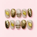 Citrine Band short press-on nails in milky cream and gold with framed citrine stones and carved gold waves