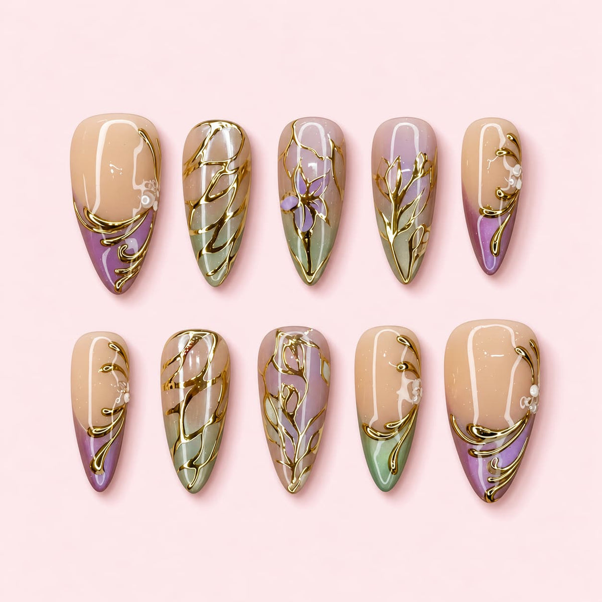 Gilded Iris almond press-on nails in nude lavender and sage with raised gold irises, leaves and scrolling vines