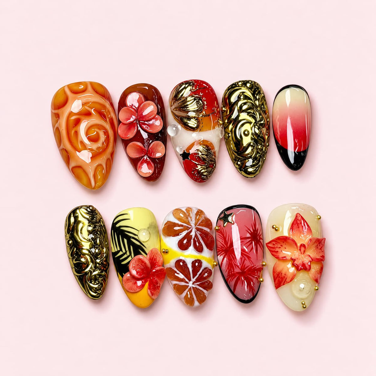 Golden Tropics almond press-on nails with sculpted coral flowers, carved gold baroque nails and citrus segments