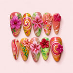 Hibiscus Sunset almond press-on nails with sculpted pink and red hibiscus flowers over a coral, mango and green wash