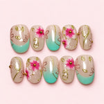 Mint Blossom short press-on nails in shimmering cream and mint with sculpted pink flowers and gold vine work
