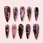 Molten Rose stiletto press-on nails in magenta black and copper with large silver beads and molten line work