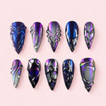 Nightshade Armour stiletto press-on nails in violet and blue oil-slick with sculpted silver ridges and clear domes