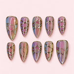Opal Lattice Stiletto press-on nails with a pastel opal base and raised gold-toned lattice and arch line work