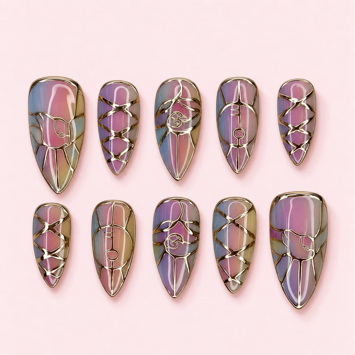 Opal Lattice Stiletto press-on nails with a pastel opal base and raised gold-toned lattice and arch line work