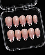 Silver chrome-look French tip press-on nails on nude glitter almond set