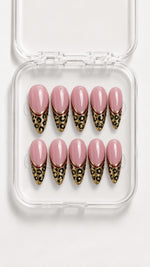 Pink Leopard French Tip Almond Press-On Nails with leopard-print tips, gold glitter, burgundy lines and a glossy pink base