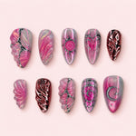 Rose Sigil almond press-on nails in magenta and smoke grey with silver sun, heart and moon line work