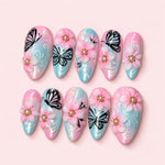 Sakura Butterfly almond press-on nails in pearl pink and baby blue with sculpted cherry blossoms and painted butterflies