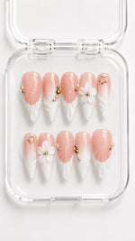 White Floral French Tip Stiletto Press-On Nails with 3D white French tips, sculpted flowers, pearls, gold star charm and beads