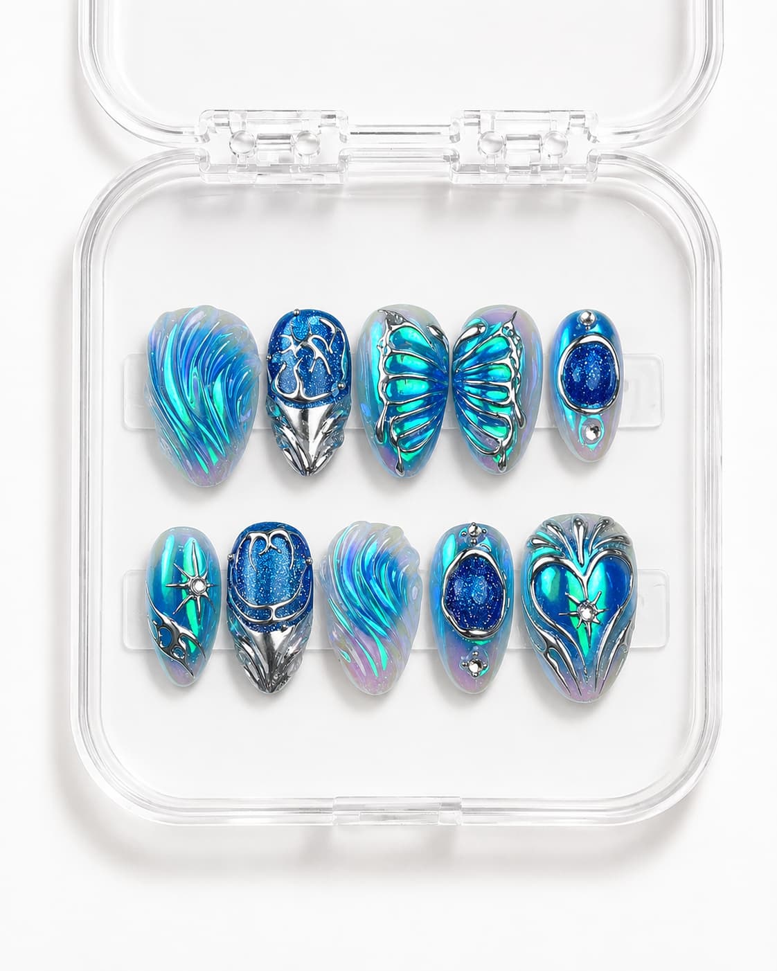 Short almond press-on nails with blue-teal color shift, 3D butterfly wings, silver details and gemstones