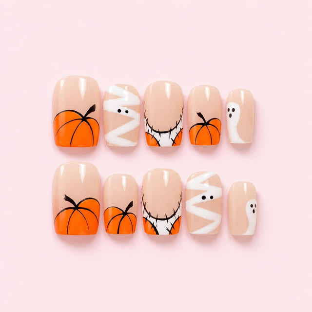 Cute Halloween Square Press-On Nails with hand-painted orange pumpkins, white mummy wraps and ghosts on a glossy nude base.