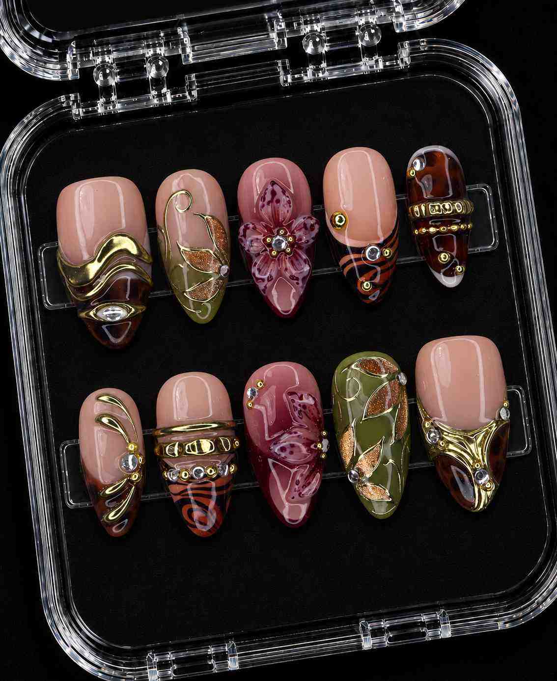 Fall floral gold short almond press-on nails with burgundy flowers, olive leaves, animal print, gemstones, and gold details.