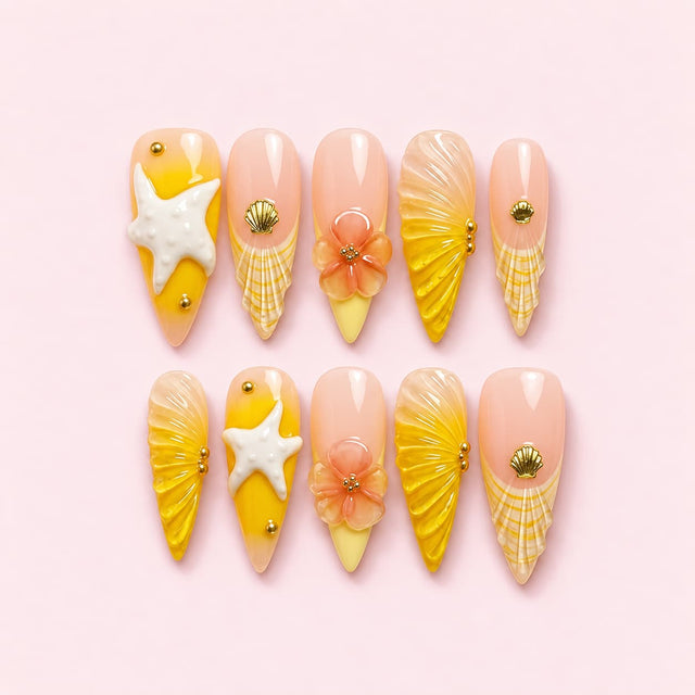 Golden Shell Stiletto Press-On Nails with 3D starfish, flowers, seashell details, pearl gradients and gold bead accents.
