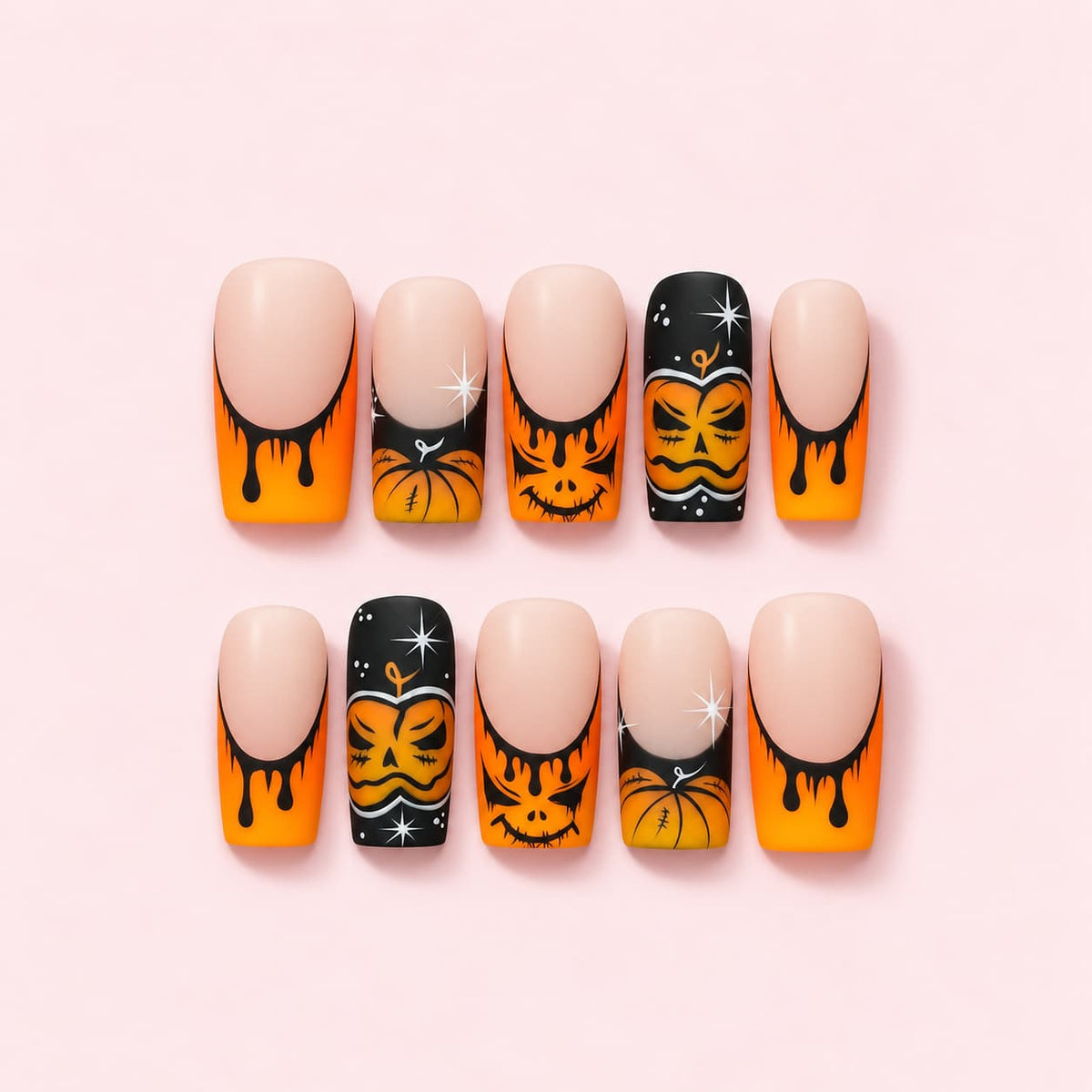 Halloween Pumpkin French Press-On Nails with orange dripping tips, hand-painted jack-o'-lanterns and black sparkle accent nails.
