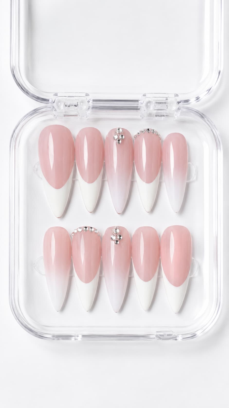 Pink French Tip Almond Press-On Nails with soft pink nude base, classic white French tips, ombré accents and gemstone clusters