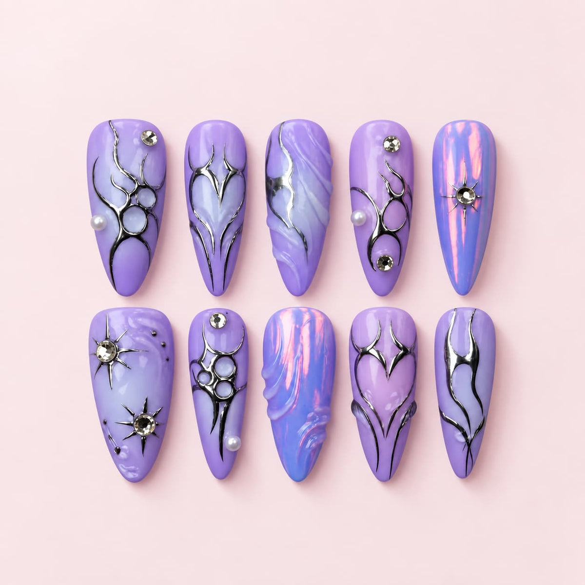 Purple Silver Chrome Stiletto Press-On Nails with lilac iridescent bases, raised silver swirls, rhinestones, and heart details
