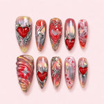 Silver Heart Chrome Stiletto Press-On Nails with 3D red hearts, raised silver chrome detailing, and an iridescent pink aura base.