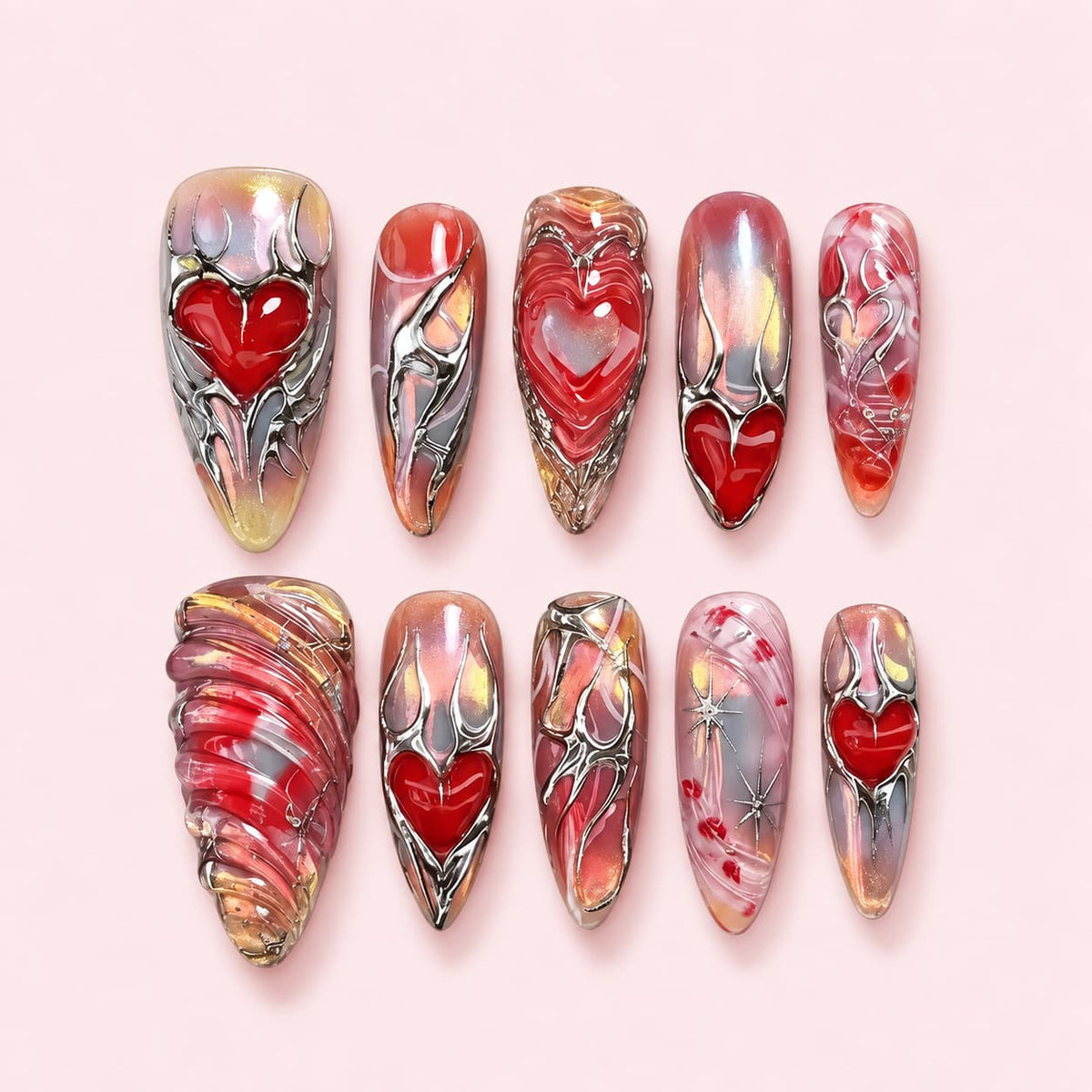 Silver Heart Chrome Stiletto Press-On Nails with 3D red hearts, raised silver chrome detailing, and an iridescent pink aura base.