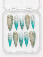 Teal Gold Floral Stiletto Press-On Nails with nude-to-teal gradient, 3D gold flowers, scrollwork, pearls, gemstones and silver glitter