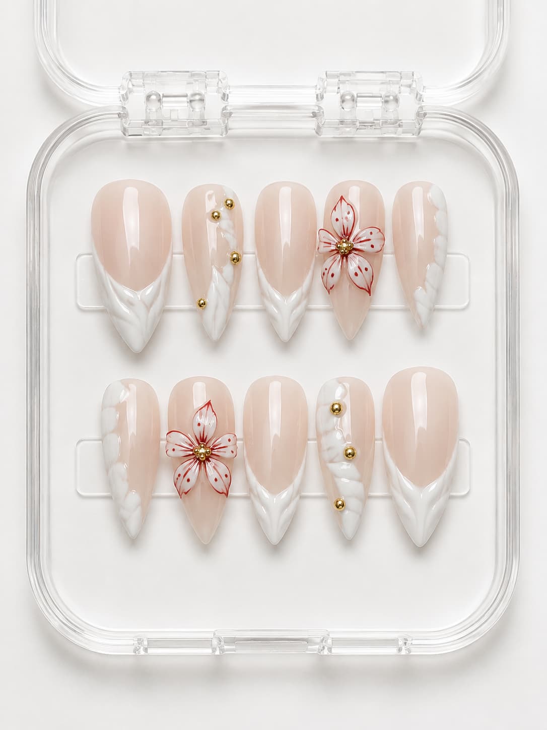 White Floral French Tip Almond Press-On Nails with nude base, 3D white French tips, red floral detail and gold bead accents